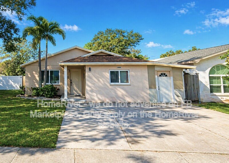 4 bedroom home with a fenced yard property image