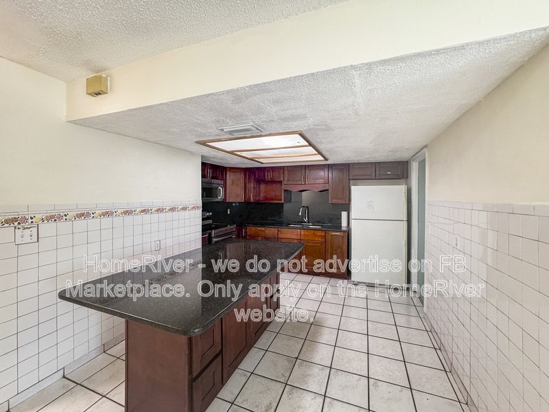 4 bedroom home with a fenced yard property image