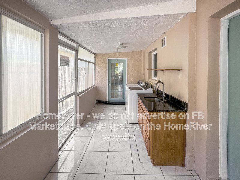 4 bedroom home with a fenced yard property image
