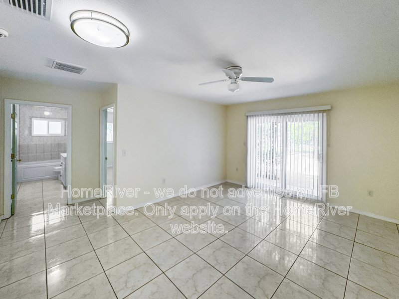 4 bedroom home with a fenced yard property image