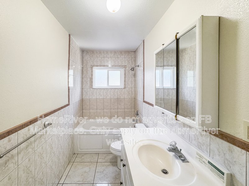 4 bedroom home with a fenced yard property image