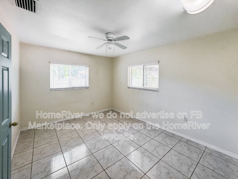 4 bedroom home with a fenced yard property image