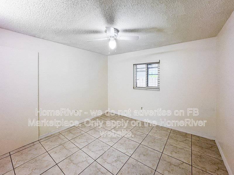 4 bedroom home with a fenced yard property image