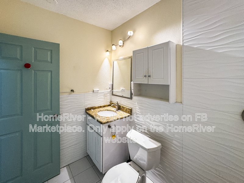 4 bedroom home with a fenced yard property image