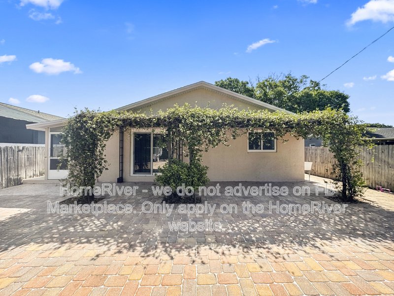 4 bedroom home with a fenced yard property image