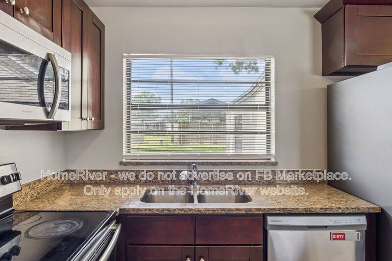 4 bedroom home with fenced yard property image